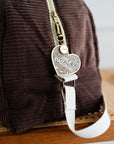 porte-cles-charms-de-sac-leopard-best-daronne-marron-en-metal-dore-milinane